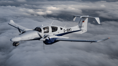 A twin-engine multi-mission aircraft operated by QinetiQ flying above cloud cover, configured for surveillance, test, and intelligence-gathering roles.