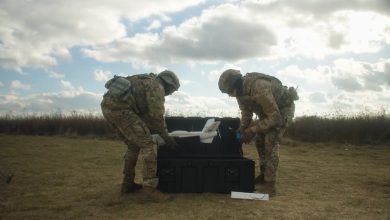 Soldiers handling a drone systems.
