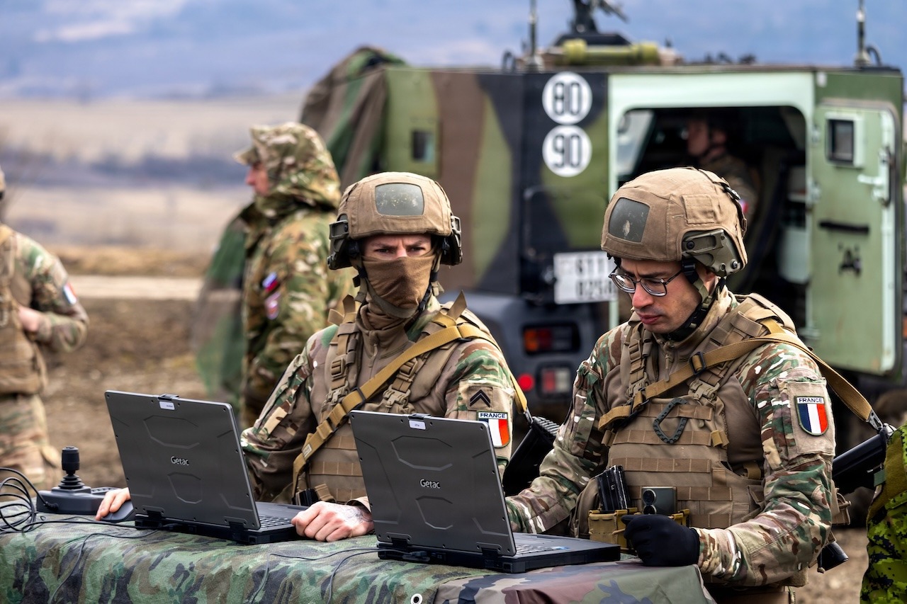 French Armed Forces Soldiers monitor the observation point during a live fire exercise of the CAESAR howitzer
