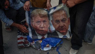 Shiite Muslims burn banners of US President Donald Trump and Israeli Prime Minister Benjamin Netanyahu during a protest against the killing of Iran's Supreme Leader Ayatollah Ali Khamenei in Budgam, northeast of Srinagar, Jammu and Kashmir, on March 6, 2026.