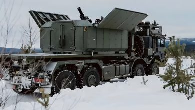 Rheinmetall Ragnarok 120mm truck-mounted mortar with open roof panels positioned in a winter landscape, showcasing its shoot-and-scoot mobile fires capability