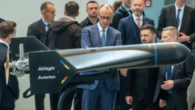 Auterion CEO Lorenz Meier, Airlogix CEO Vitalii Kolesnichenko, Ukrainian President Volodymyr Zelenskyy, and German Chancellor Friedrich Merz with an Airlogix autonomous strike system.