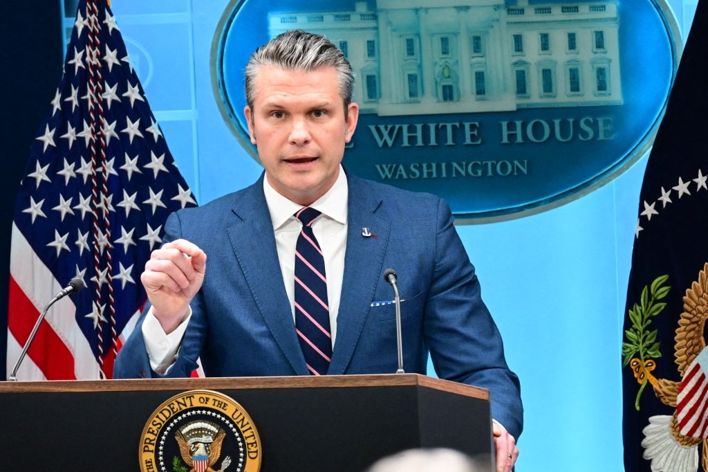US Secretary of War Pete Hegseth speaks during a news conference in the White House.