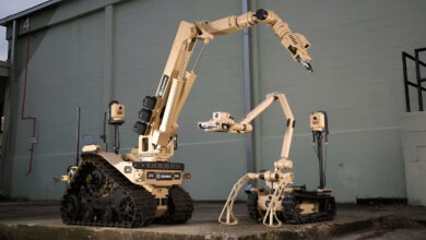 L3Harris T7 and T4 multi-mission robots side by side with manipulator arms fully extended, delivered to the Australian Defence Force for explosive ordnance disposal and high-risk missions