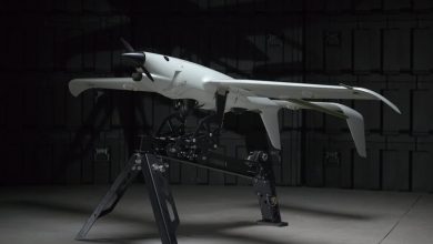 Skyeton Raybird fixed-wing reconnaissance UAV on a ground display stand, now upgraded with real-time anti-interceptor detection capability