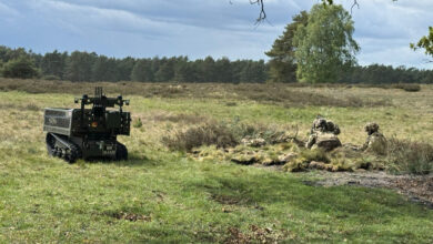 Soldiers operating alongside an X Series unmanned ground vehicle. Photo: Digital Concepts Engineering