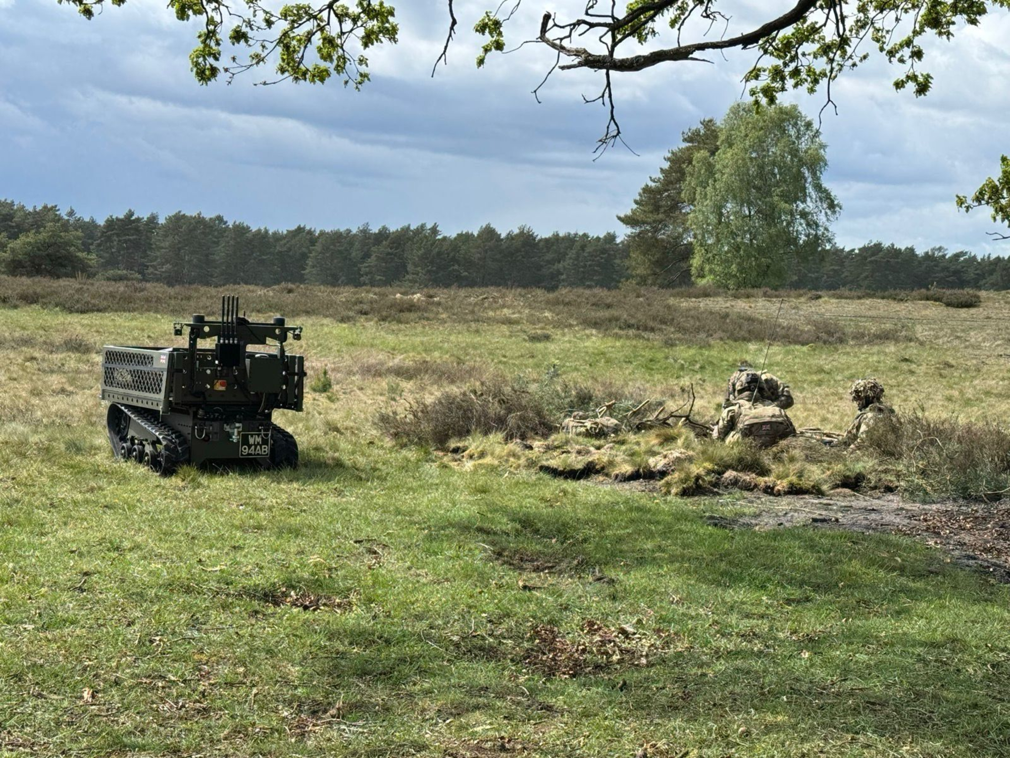 Soldiers operating alongside an X Series unmanned ground vehicle. Photo: Digital Concepts Engineering