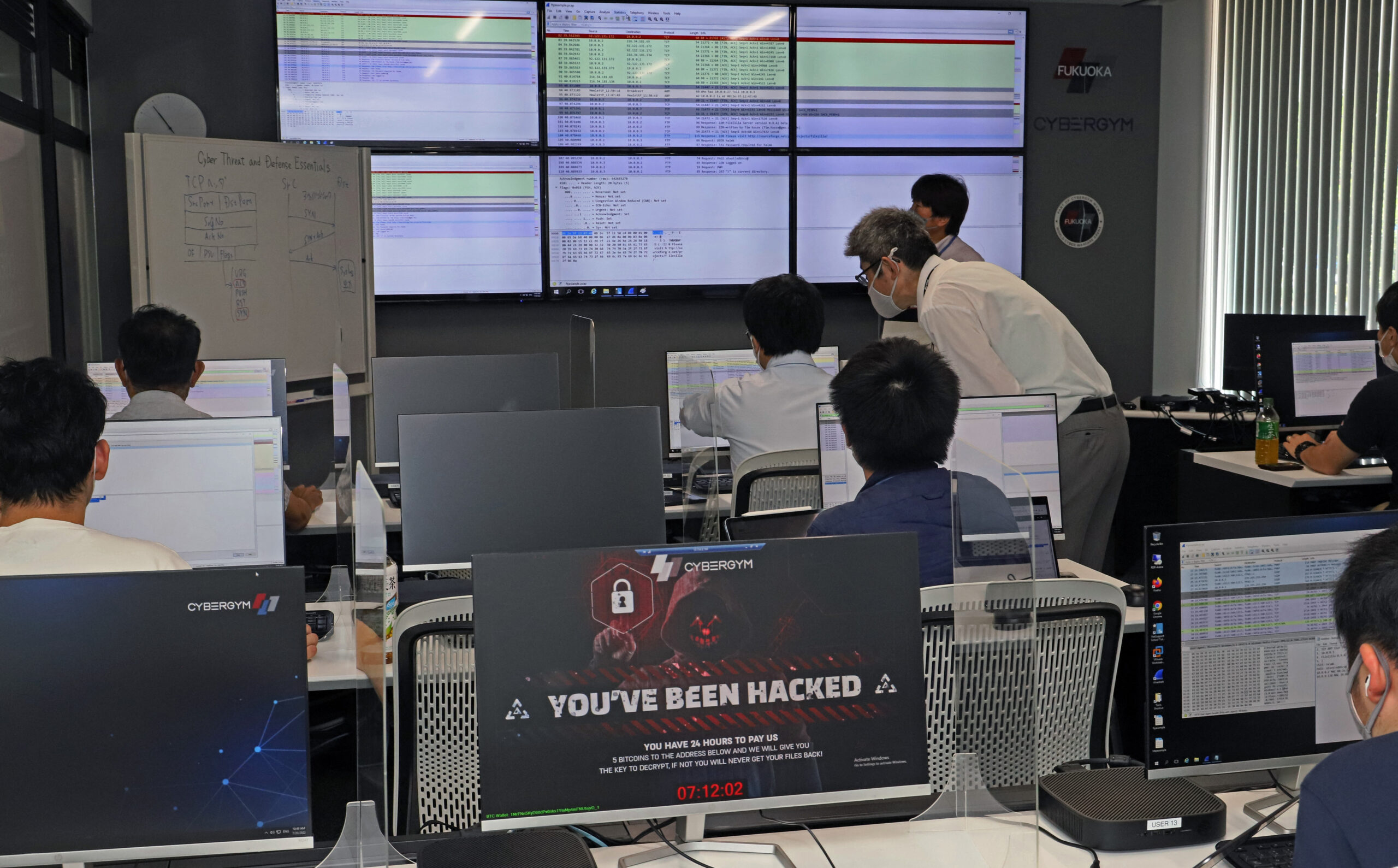 Company employees and college students take part in a workshop to prevent cyber attacks in Fukuoka Prefecture on July 20, 2022.