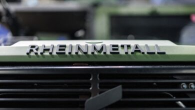 The logo lettering of the Rheinmetall armaments group is on a vehicle at the company's stand at the Enforce Tac trade fair for security and defense.