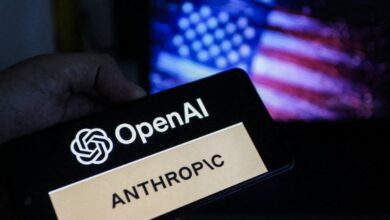 A smartphone displays the OpenAI and Anthropic logos in front of a blurred US flag. OpenAI has launched a US-only preview of its GPT-5.6 AI models following a federal national security review.