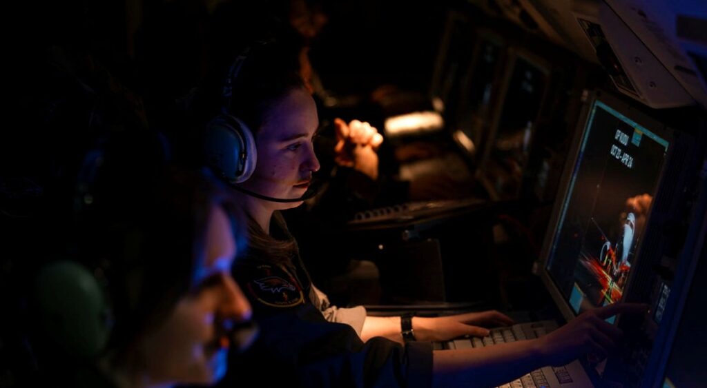 Surveillance and control officers at their terminals on a Royal Australian Air Force E-7A Wedgetail aircraft deployed on Operation Kudu in Germany.