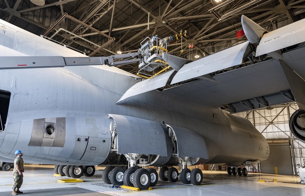US Air Force maintainers inspect the wing of a C-5M Super Galaxy during routine maintenance at Travis Air Force Base, California. Photo: Heide Couch/DVIDS