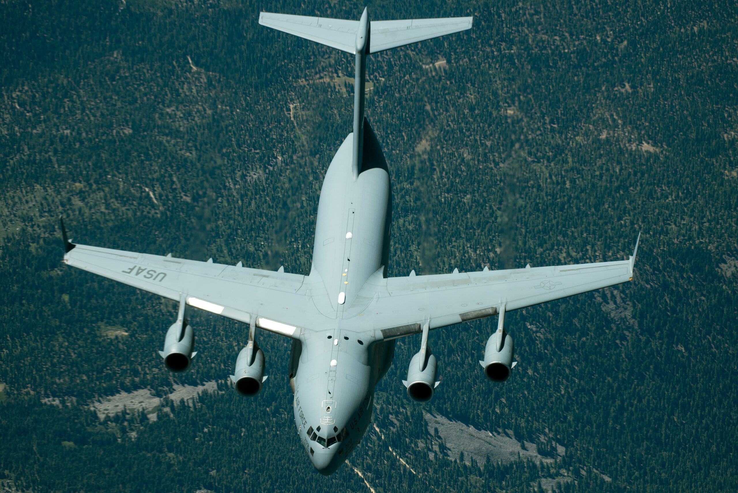 A C-17 Globemaster III from the 301st Airlift Squadron, 349th Air Mobility Wing, Travis Air Force Base, Calif., is refueled by a KC-10 Extender,