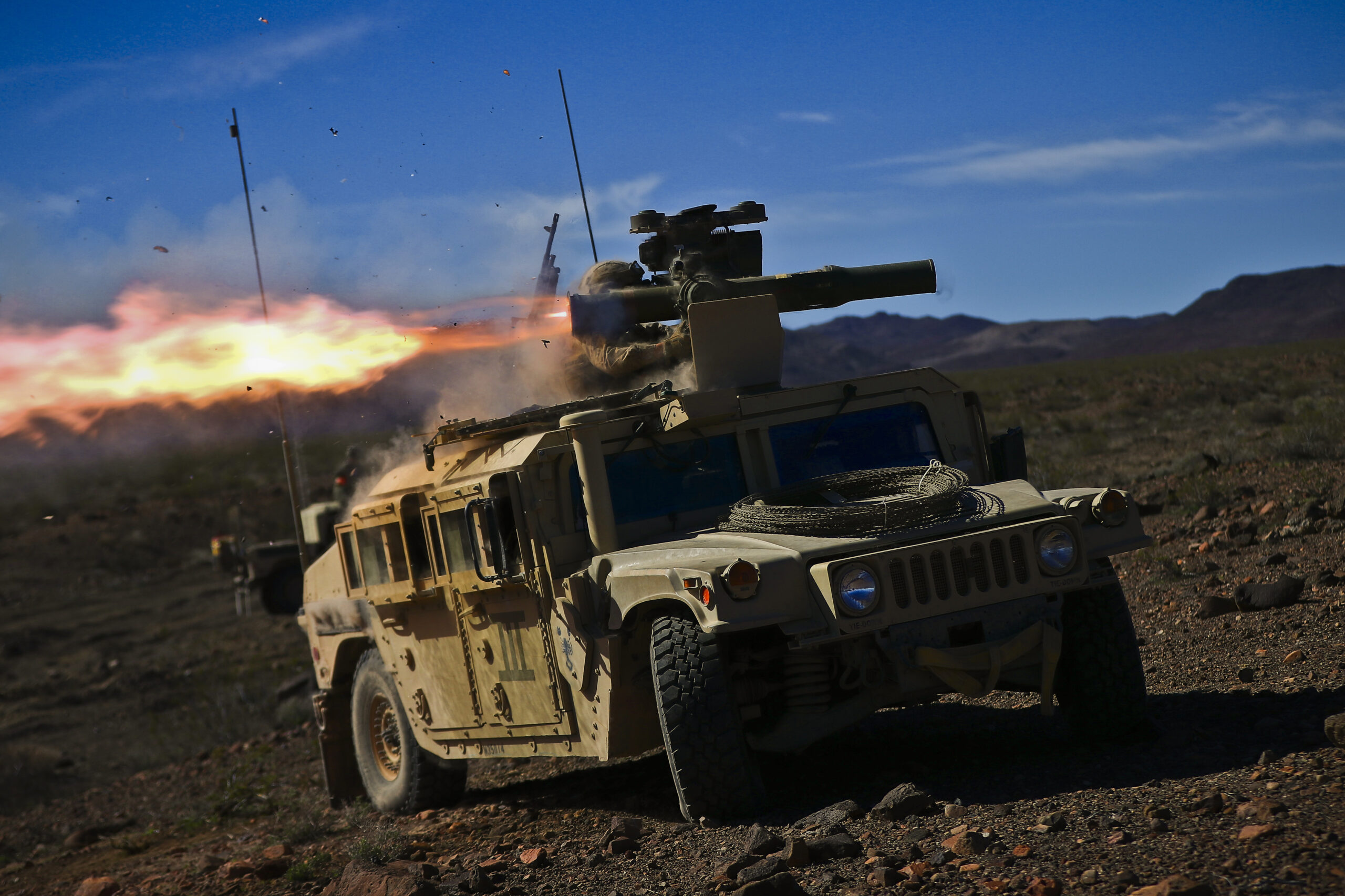 Pfc. Derek T. Hall, a tube-launched optically tracked wire-guided (TOW) gunner assigned to Combined Anti-Armor Team 1, Weapons Company, 1st Battalion, 3rd Marine Regiment, fires a TOW missile during Integrated Training Exercise (ITX) 2-17 aboard Marine Corps Air Ground Combat Center, Twentynine Palms, California, Feb. 16, 2017. ITX is a combined-arms exercise which gives all elements of the Marine Air Ground Task Force an opportunity to utilize capabilities during large scale missions to become a more ready fighting force. 1/3 is currently participating as the ground combat element for this exercise. (U.S. Marine Corps photo by Cpl. Aaron S. Patterson/Released)