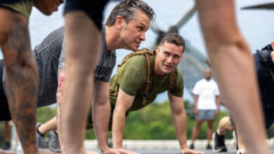 Secretary of War Pete Hegseth does push-ups with U.S. Marines from the 11th Marine Expeditionary Unit and Sailors assigned to Wasp-class amphibious assault ship USS Boxer (LHD 4) during a physical training event in Singapore, May 29, 2026. The 11th MEU, embarked aboard the Boxer Amphibious Ready Group, is a persistent, combat credible force contributing to deterrence and crisis response in the U.S. 7th Fleet area of operations. U.S. 7th Fleet, the U.S. Navy's largest forward-deployed numbered fleet, routinely interacts and operates with allies and partners to preserve a free and open Indo-Pacific. (U.S. Marine Corps photo by Sgt. Trent A. Henry)