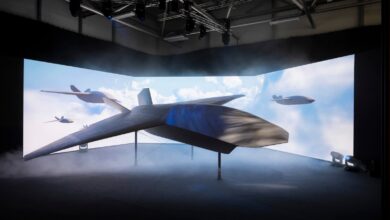 The stealthy BAE Systems Brontanax uncrewed autonomous fighter drone prototype on stage at the Farnborough Airshow, developed under the UK's Storm Fighter sovereign CCA program.