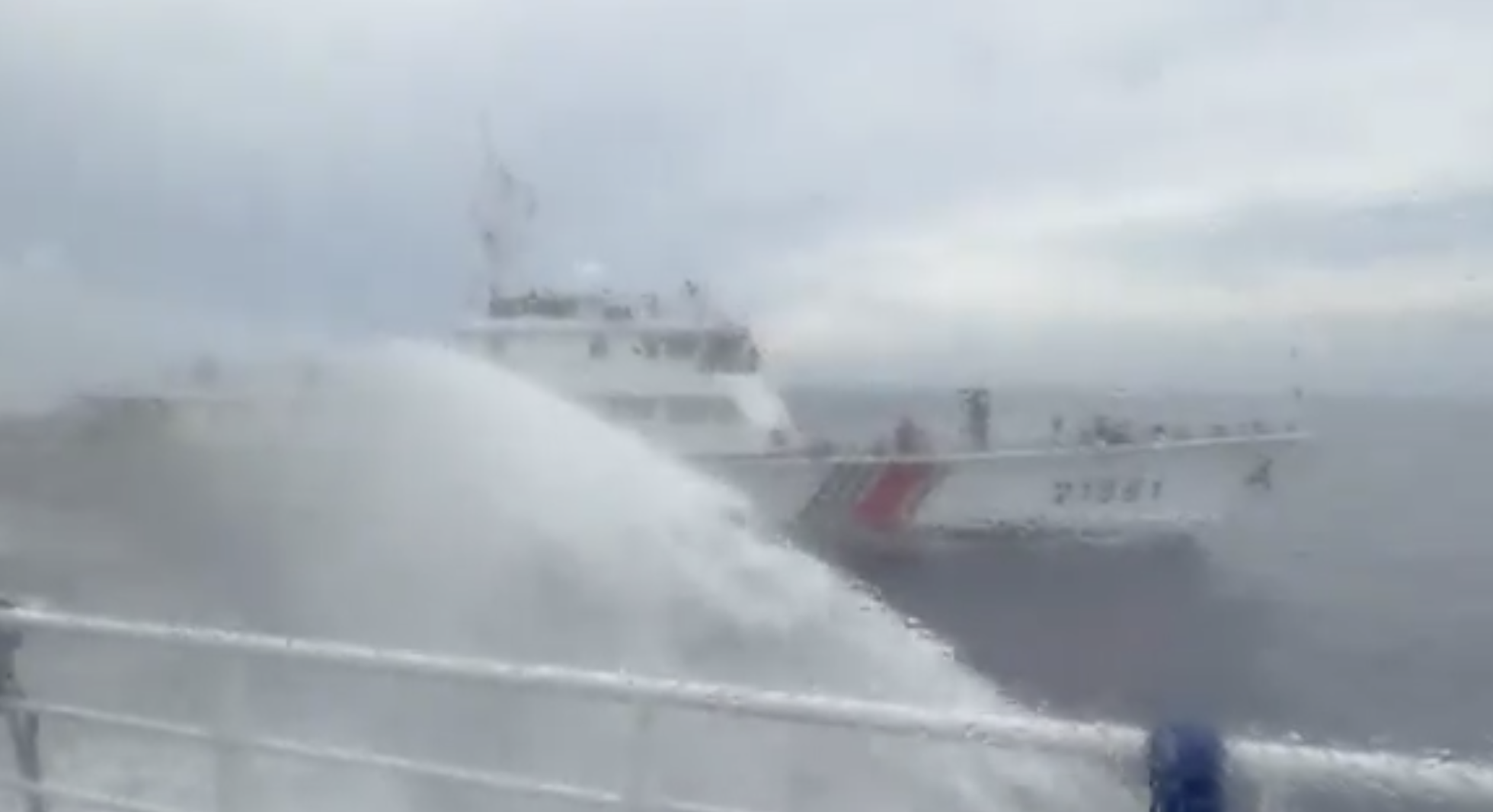 Screenshot from video showing a China Coast Guard vessel firing a water cannon at a Philippine Coast Guard vessel during a resupply mission near Bajo de Masinloc on July 24, 2026.